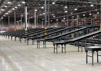 Series of shipping conveyers in a warehouse.