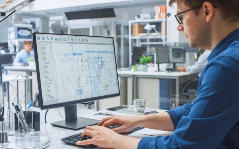 Person working on CAD design software.