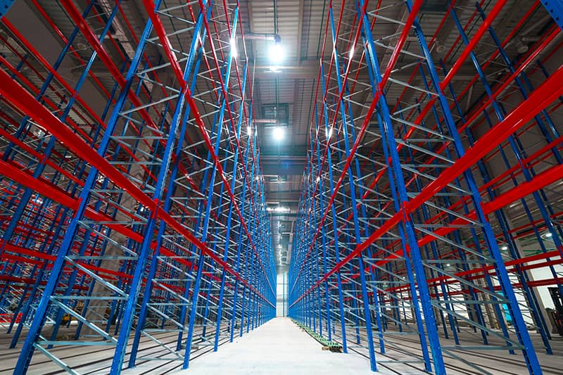 Large modern warehouse with forklifts