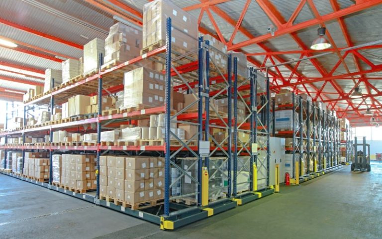 Organized warehouse with stacked pallets.