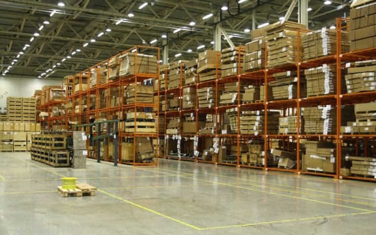 Large warehouse filled with stacked boxes