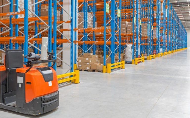 Warehouse with shelves and forklift