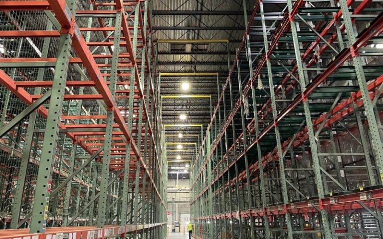Empty warehouse with tall storage racks