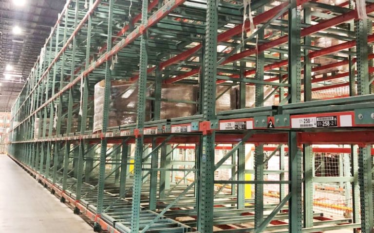 Empty warehouse shelving units in rows