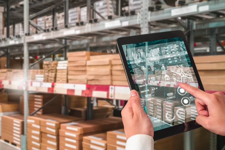 Person using tablet in warehouse