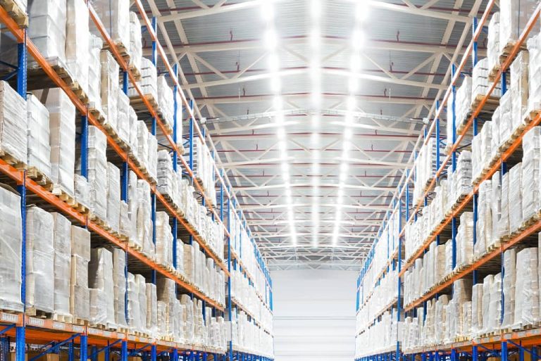 Warehouse with stacked pallets on racks